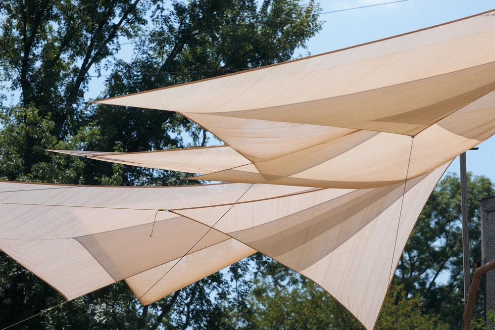 aesthetic,fabric,canopies,positioned,above,an,outdoor,area,provide,shade